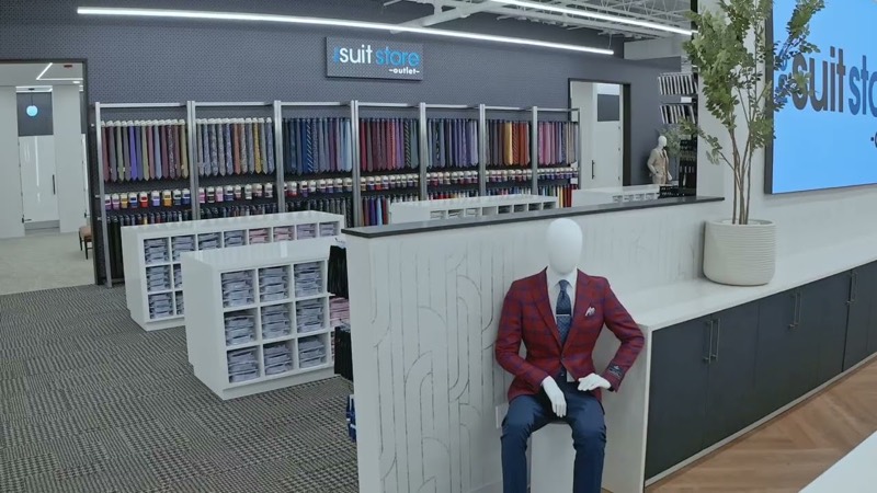 The Suit Store showroom with racks of suits